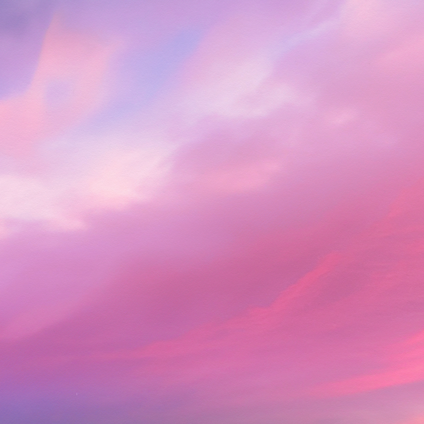 Soft pink and purple clouds drifting across a pastel sky with no visible product or packaging.